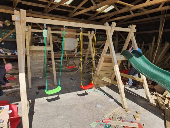 Play centre with swing and slide